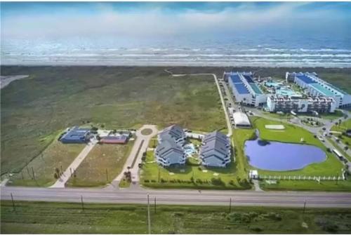 an aerial view of a resort next to the ocean at Jacks Spot MIBC 116 in Mustang Beach