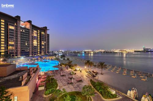 an aerial view of a resort with a body of water at bnbmehomes - Tiara Tanzanite in Dubai