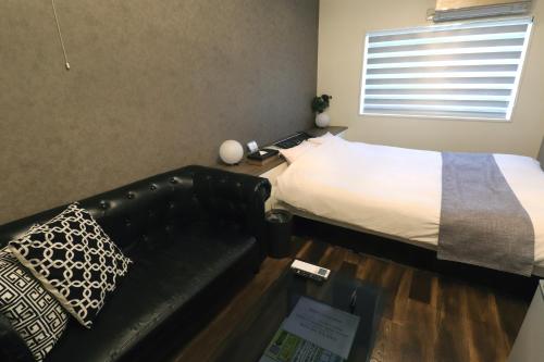 Postel nebo postele na pokoji v ubytování Spa & HOTEL La fontaine