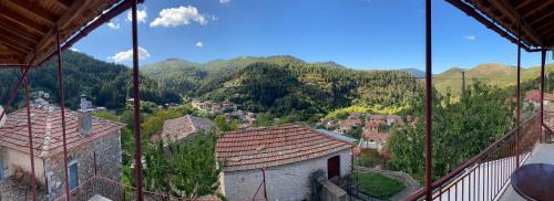 a view of a village with mountains in the background at Forrest Guesthouse in Polídhroson