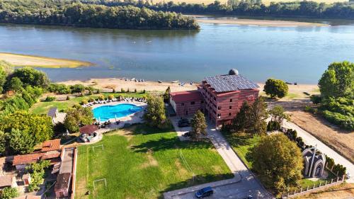 an aerial view of a resort with a lake at Prestige Hotel in Belene
