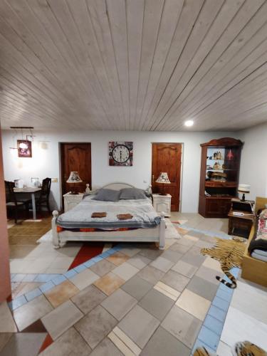 a large bedroom with a bed and a ceiling at HOMESTAY ,,Aurora,, in Vilnius