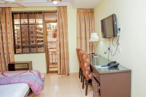 Télévision ou salle de divertissement dans l'établissement Sleep Inn Hotel - Kariakoo
