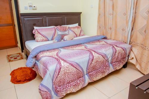 Un ou plusieurs lits dans un hébergement de l'établissement Sleep Inn Hotel - Kariakoo