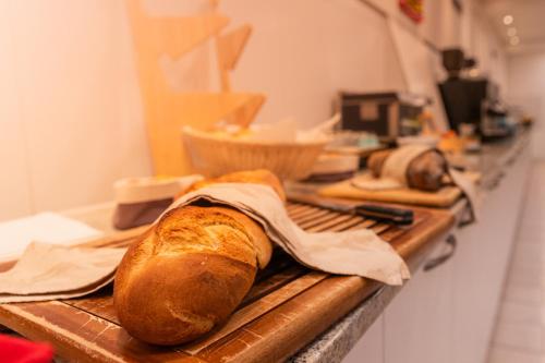 a loaf of bread sitting on a counter in a kitchen at Jura Sport & Spa Resort in Saignelégier