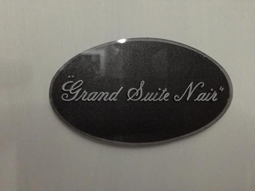 a sign that says grand shuttle mail on a wall at Alba Camere in Palermo