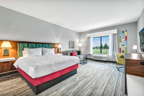 a hotel room with a bed and a desk at Hampton Inn Zion Crossroads Gordonsville in Gordonsville