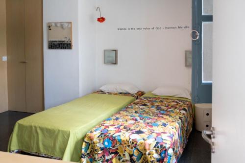 a bedroom with two beds in a room at ResArt Traditional House in Nicosia