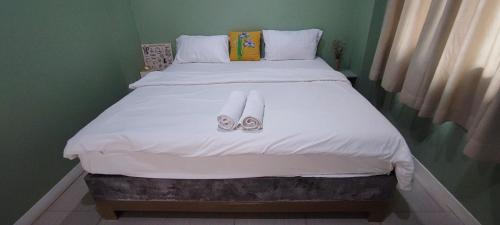 Katil atau katil-katil dalam bilik di บ้านพักในสวนK&N2