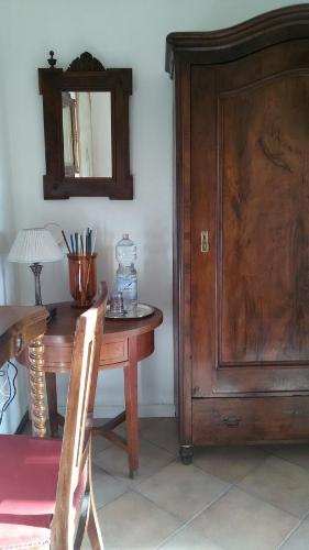 a room with a wooden table and a wooden door at Villa Fiorita in Monfalcone