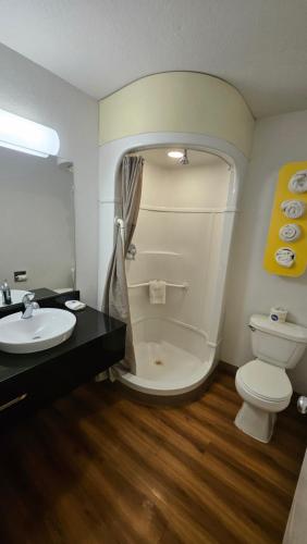 a bathroom with a white toilet and a sink at Motel 6-Blythe, CA in Blythe