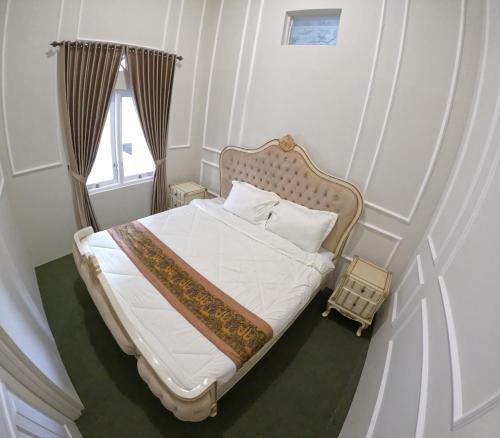 Postel nebo postele na pokoji v ubytování House of Masjid Jogokariyan