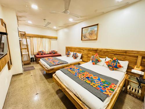 Postel nebo postele na pokoji v ubytování Hotel Regency