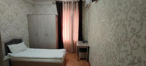 Katil atau katil-katil dalam bilik di Diyora Hostel