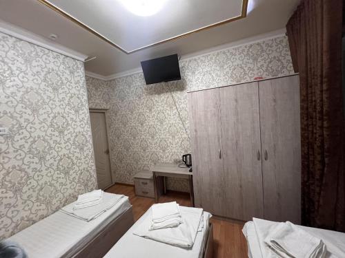 Katil atau katil-katil dalam bilik di Diyora Hostel