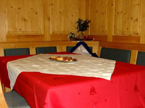 a room with a table with a plate of food on it at Ferienwohnung Haus König in Türnitz