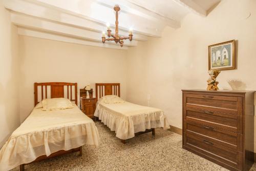 Ένα ή περισσότερα κρεβάτια σε δωμάτιο στο Casa Estel Miracle