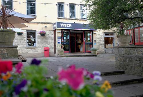 a view of a store with flowers in front of it at Bath YMCA Hostel in Bath