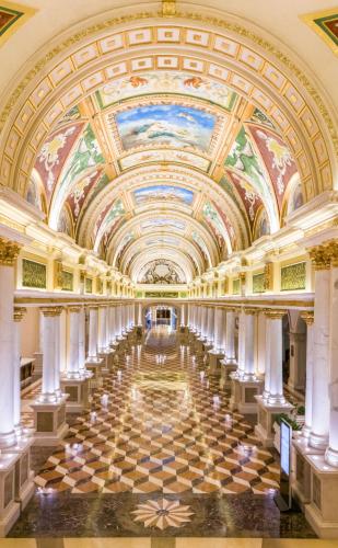 a hallway in a building with a painting on the ceiling at Guangzhou Phoenix City Hotel-Free Shuttle for Canton Fair 15th Oct to 5th Nov in Zengcheng