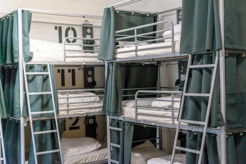 a group of bunk beds in a room at Bath YMCA Hostel in Bath