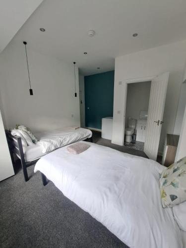 a room with two beds in a room at Cleadon in Goole