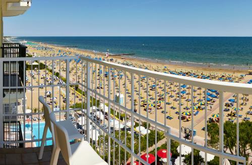 a view of the beach from the balcony of a resort at Termini Beach Hotel & Suites in Lido di Jesolo
