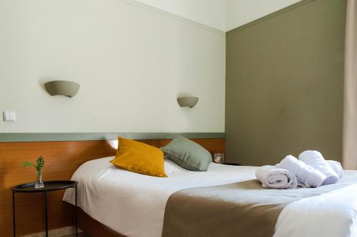 Postel nebo postele na pokoji v ubytování Anesis Hotel