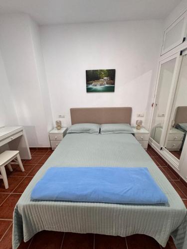 Ένα ή περισσότερα κρεβάτια σε δωμάτιο στο Casa Tajinaste