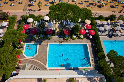 an overhead view of a pool at a resort at Termini Beach Hotel & Suites in Lido di Jesolo