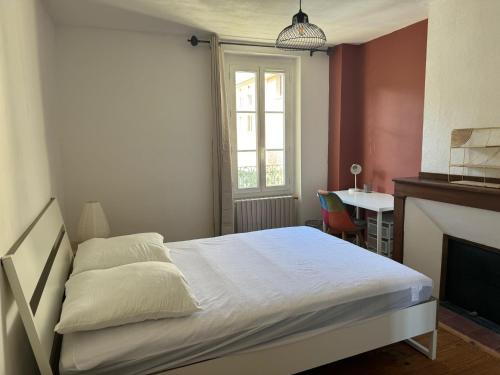 Postel nebo postele na pokoji v ubytování La Petite Fuxéenne