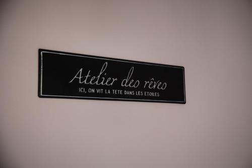 a sign that says afterdoctordo tico on a wall at Les bottines in Pont-d'Ouilly