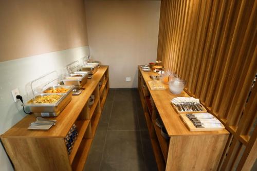 a buffet line in a restaurant with many plates of food at 사이공 트래블 라운지 Saigon Travel Lounge in Ho Chi Minh City