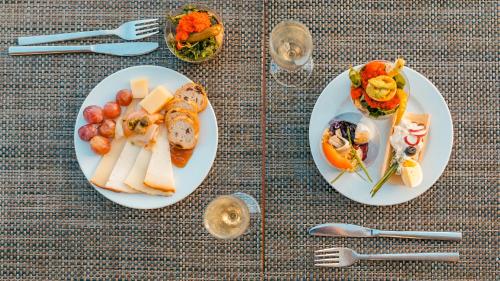 two plates of food sitting on a table at Labranda Alyssa Suite Hotel in Playa Blanca