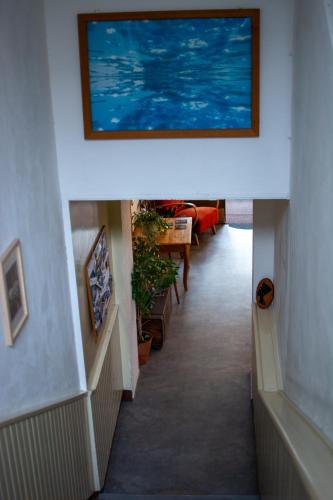 a hallway with a painting on the wall at Hostel Moravia Ostrava in Ostrava