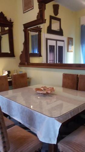 a table with a table cloth on it in a room at Villa Fiorita in Monfalcone
