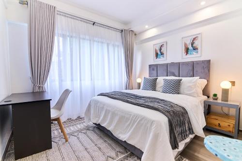 Ένα ή περισσότερα κρεβάτια σε δωμάτιο στο Luxury and Modern 2 Bdr