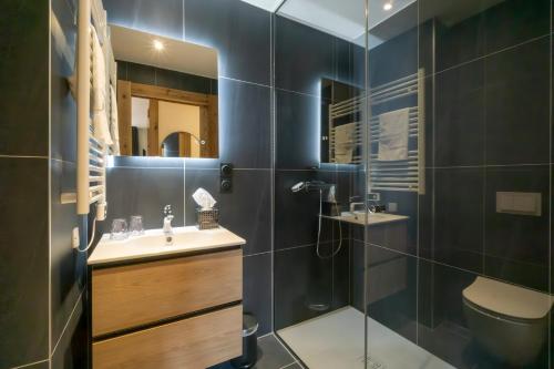 a bathroom with a sink and a shower at Hostellerie du Petit Saint Bernard in Bourg-Saint-Maurice
