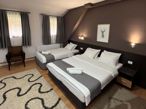 Postel nebo postele na pokoji v ubytování Hotel Junior