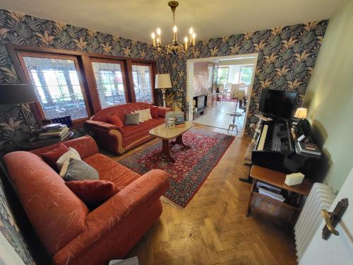 a living room with a couch and a table at Hotel Schönblick in Bad Herrenalb