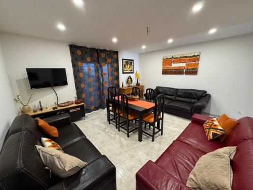 a living room with a couch and a table at Apartamento Santa Cruz in Santa Cruz
