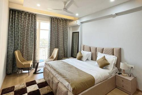 a bedroom with a bed and a table and a window at Sukoonat Gah in Srinagar