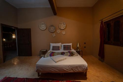 Ein Bett oder Betten in einem Zimmer der Unterkunft L'oasis Du Bonheur