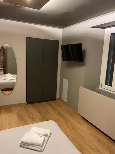 a bathroom with a black cabinet and a mirror at Albergo Ristorante Plaza in Tornolo