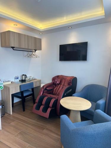 a living room with a couch and a table at hotel whiteswan in Ehnen