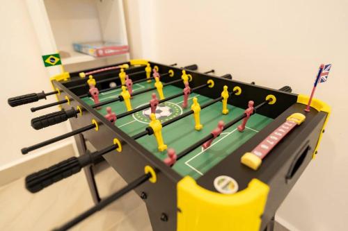 a ping pong table with people on it at A spacious 4bhk villa with a pool in Bardez