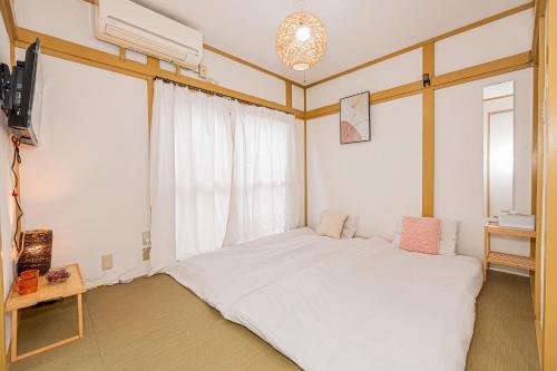 Ένα ή περισσότερα κρεβάτια σε δωμάτιο στο sunrise 2