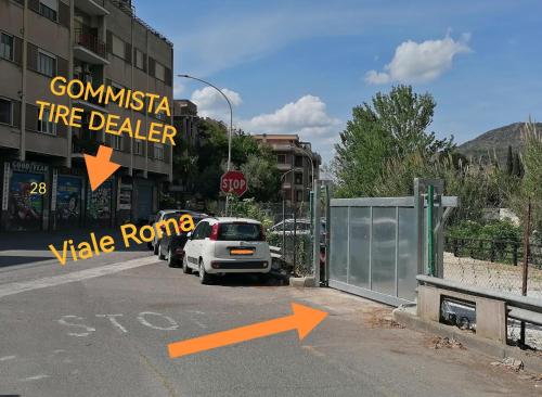 a white car parked on the side of a street at Residenze Gregoriane - Residenza d'Epoca in Tivoli