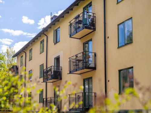 a building with balconies on the side of it at Entire Apartment Stockholm in Stockholm