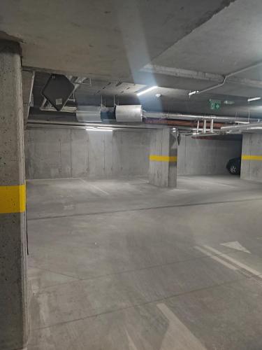 an empty parking garage with a parking lot at Apartament w Bartoszycach in Bartoszyce