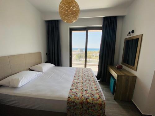 Postel nebo postele na pokoji v ubytování Anemoni Apartments